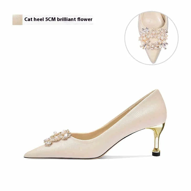 French wedding high heels with rhinestone details on cloth upper, pointed toe, and a choice of stiletto or cat heel.
