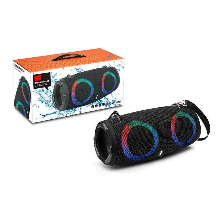 War Drum portable Bluetooth speaker with RGB coloured lights in black, showing built-in strap and control buttons.