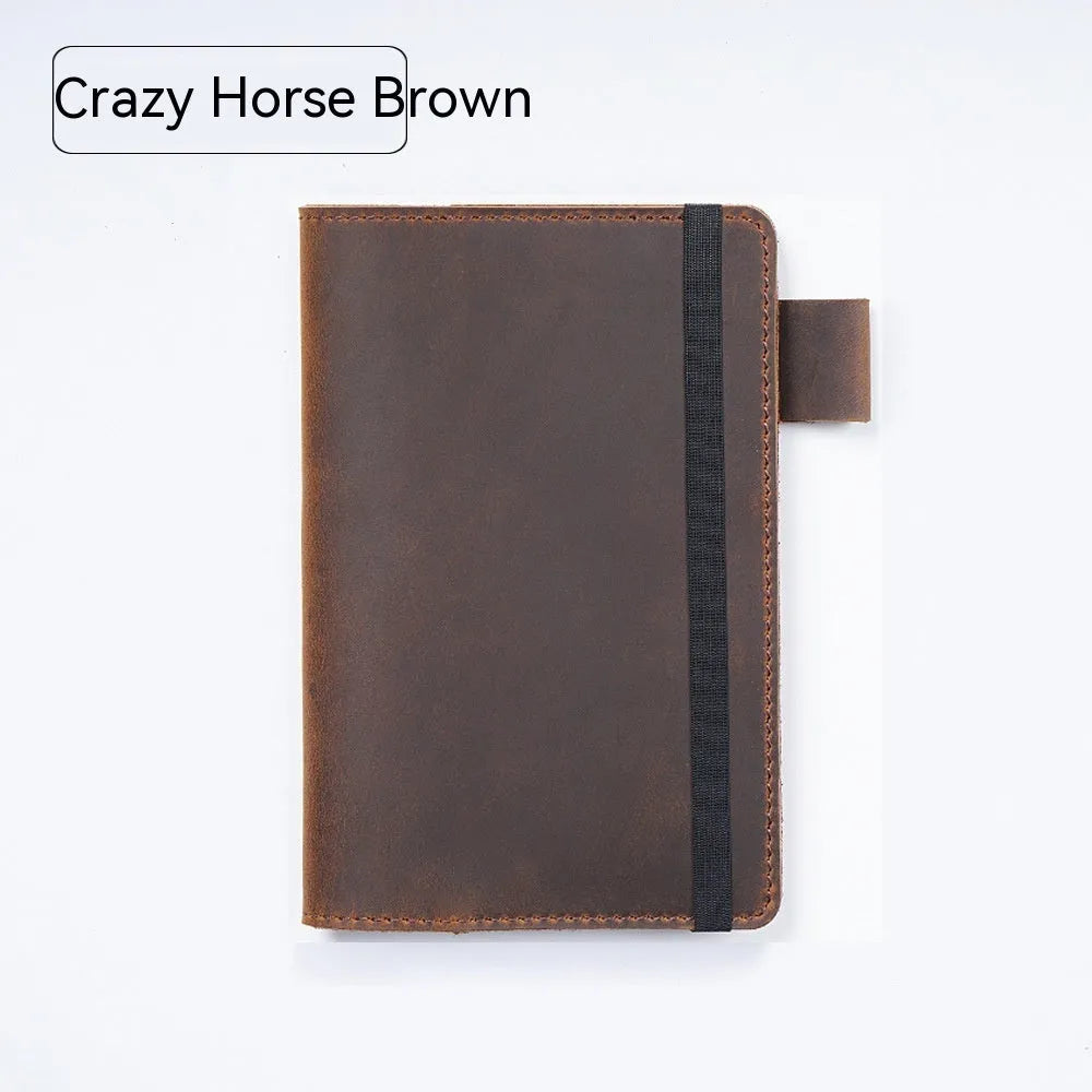 Handmade kraft notebook with cowhide cover in choice of six colours, showing open pages of wood-free paper.
