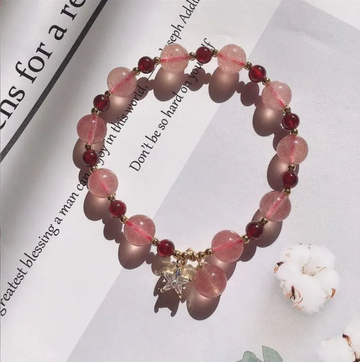 Handcrafted strawberry quartz crystal bracelet with Hetian jade peach blossom charms