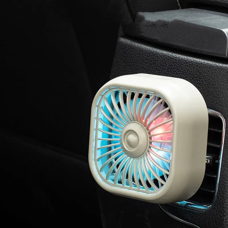 Compact USB car fan with three-speed buttons in black colour on vehicle dashboard