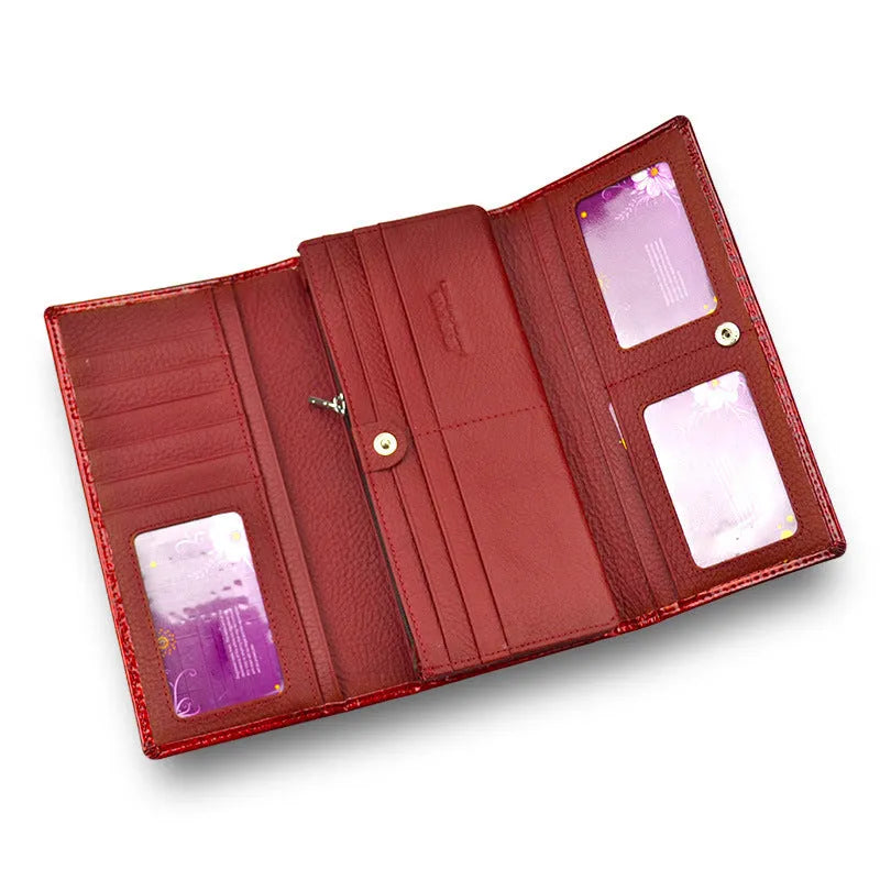 Women's red leather coin purse with crocodile pattern texture and a visible interior pigskin lining.