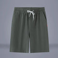 Cotton and linen casual cropped pants in Army Green with a drawstring waist.