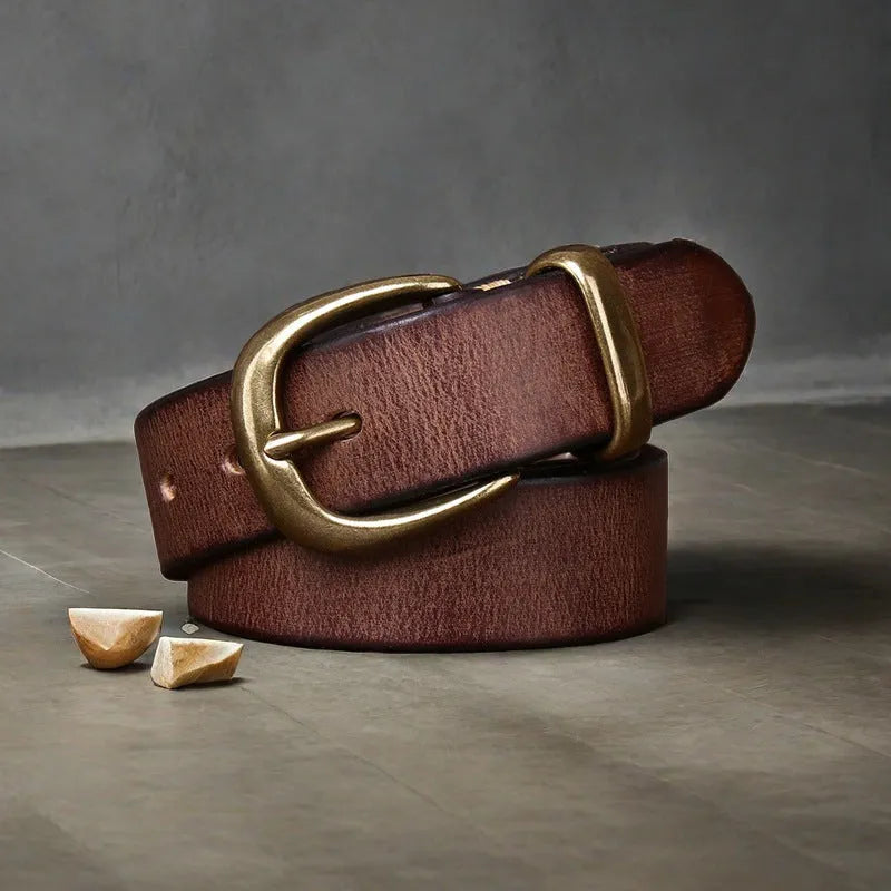 Men's brown cowhide leather casual belt with copper pin buckle on a flat surface