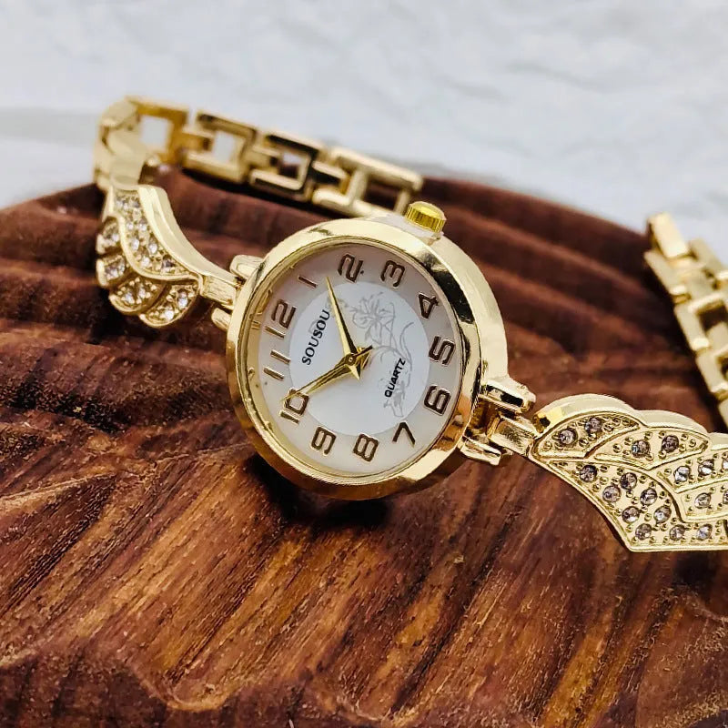 Slim stainless steel women's watch with round dial, shown in gold, black and gold, and white and gold colour variations.