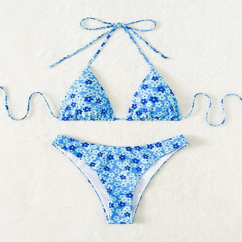 Women's blue swimsuit with lace-up front and matching side-split shorts
