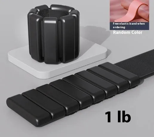 Detachable black Velcro silicone fitness bracelet with a 2lb weight on a wrist.