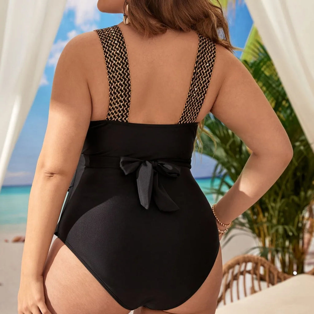 Plus size women's black one-piece swimsuit with removable chest padding