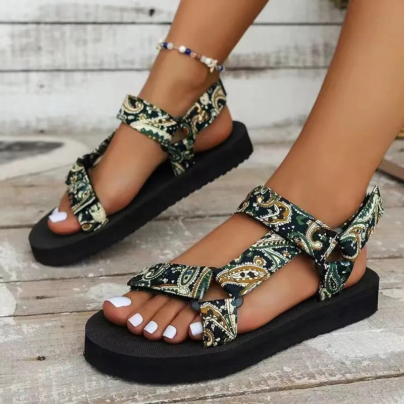 Women's ethnic print flat sandals with Velcro webbing strap and foam sole in blue and red colourways