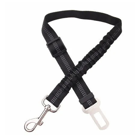 Black adjustable dog seat belt with reflective safety rope attached to car seat belt buckle, polyester webbing and alloy joint visible