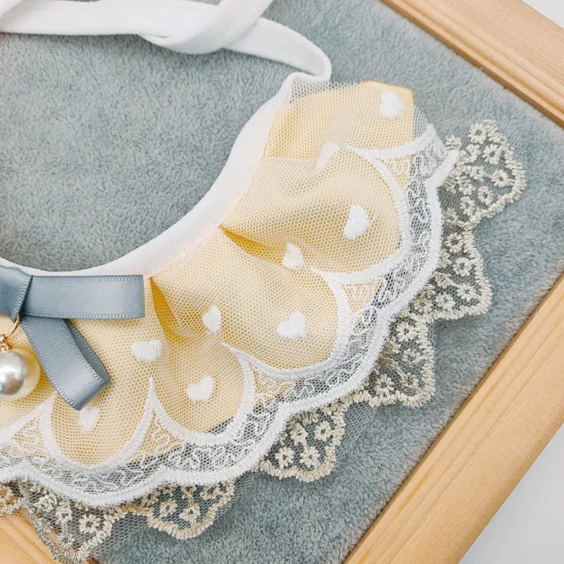 Yellow cotton polyester cat bib with lace trim, princess style, sizes XS S M L, lace and side lacing measurements shown.