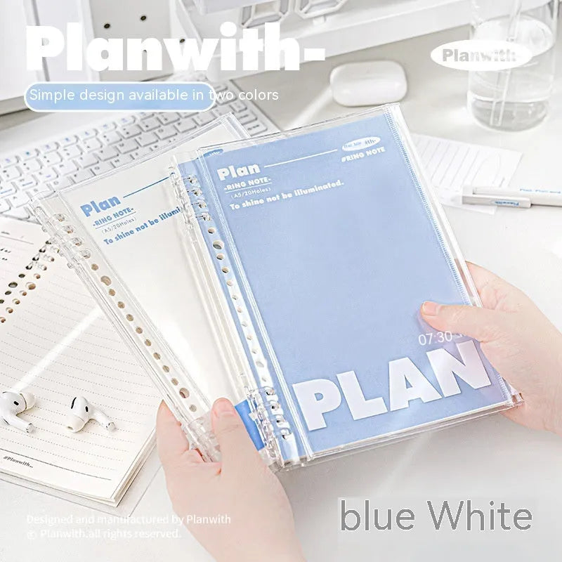 Blue and white A5 PVC spiral notebook with Wire-O binding on a flat surface