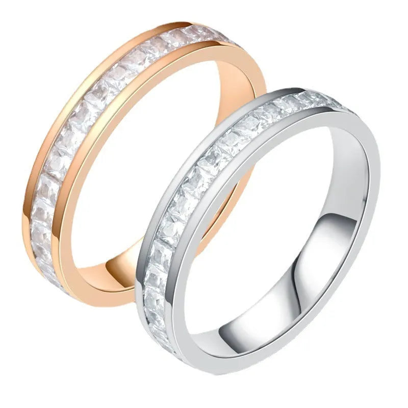 Stainless steel geometric star ring with zircon inlay in gold finish on white background