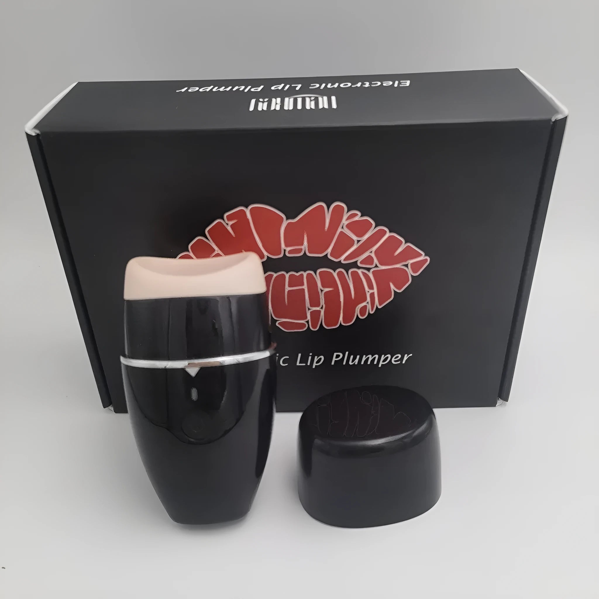 Black and white electric silicone lip plumper device with 3-speed adjustment and USB charging cable