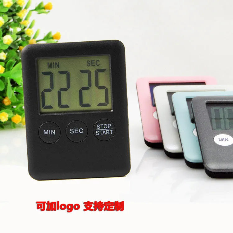 Digital kitchen timer with magnetic back in black and white colour options showing countdown display