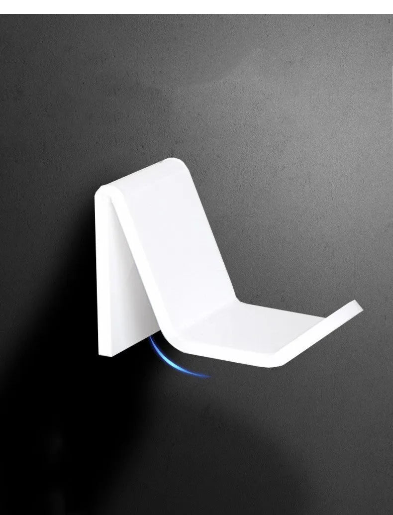 Universal game controller wall bracket in plastic available in black, white and transparent colours