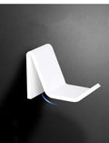 Universal game controller wall bracket in plastic available in black, white and transparent colours