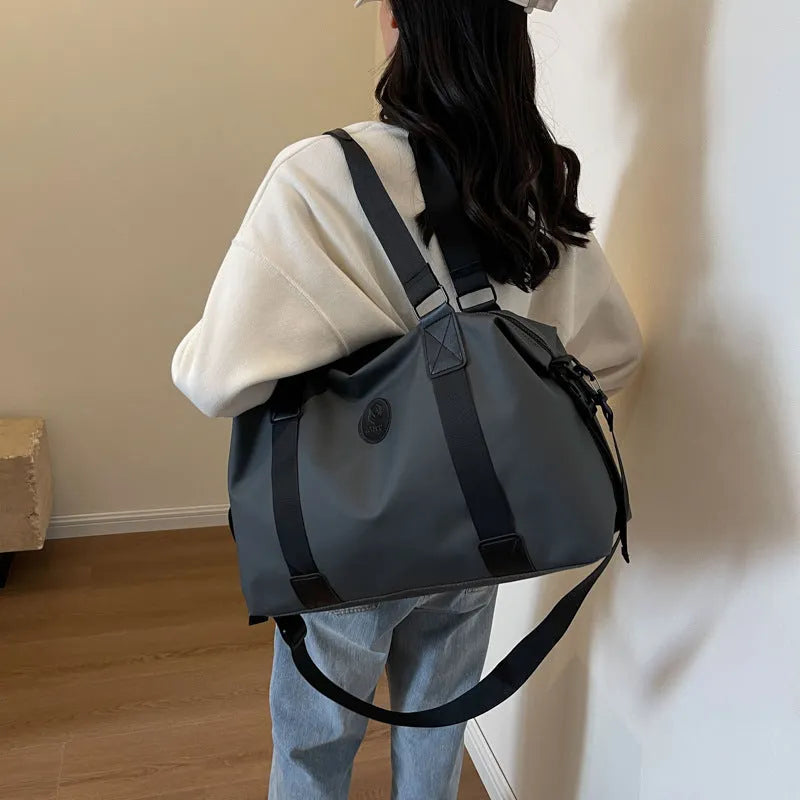 Waterproof Oxford cloth travel luggage bag in solid colour with 36-55 litre capacity