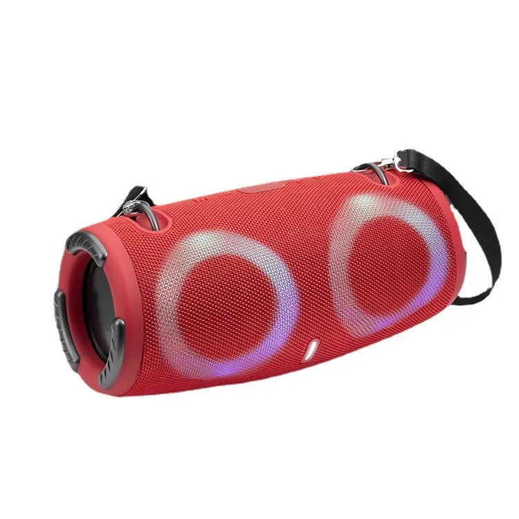 War Drum portable Bluetooth speaker with RGB coloured lights in black, showing built-in strap and control buttons.