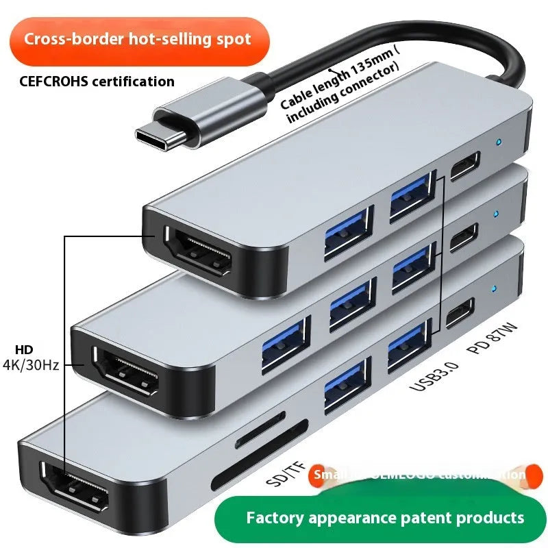 Portable silver 6-in-1 TYPE-C expansion dock with short attached cable for laptops and tablets.