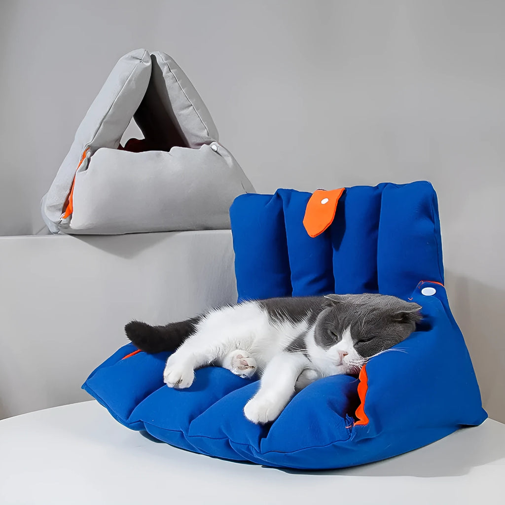 Blue triangular fabric cat bed with a sofa shape and visible connection holes on the sides.