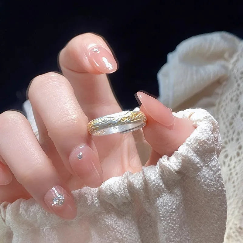 Open-mouth geometric white copper ring with Xiangyun pattern in silver-gold electroplate.