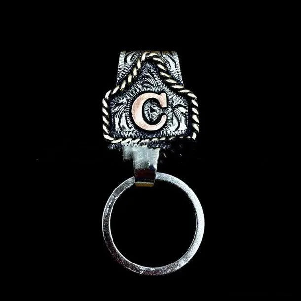 Handmade metal cow tag belt keychain in rustic design with multiple colour options