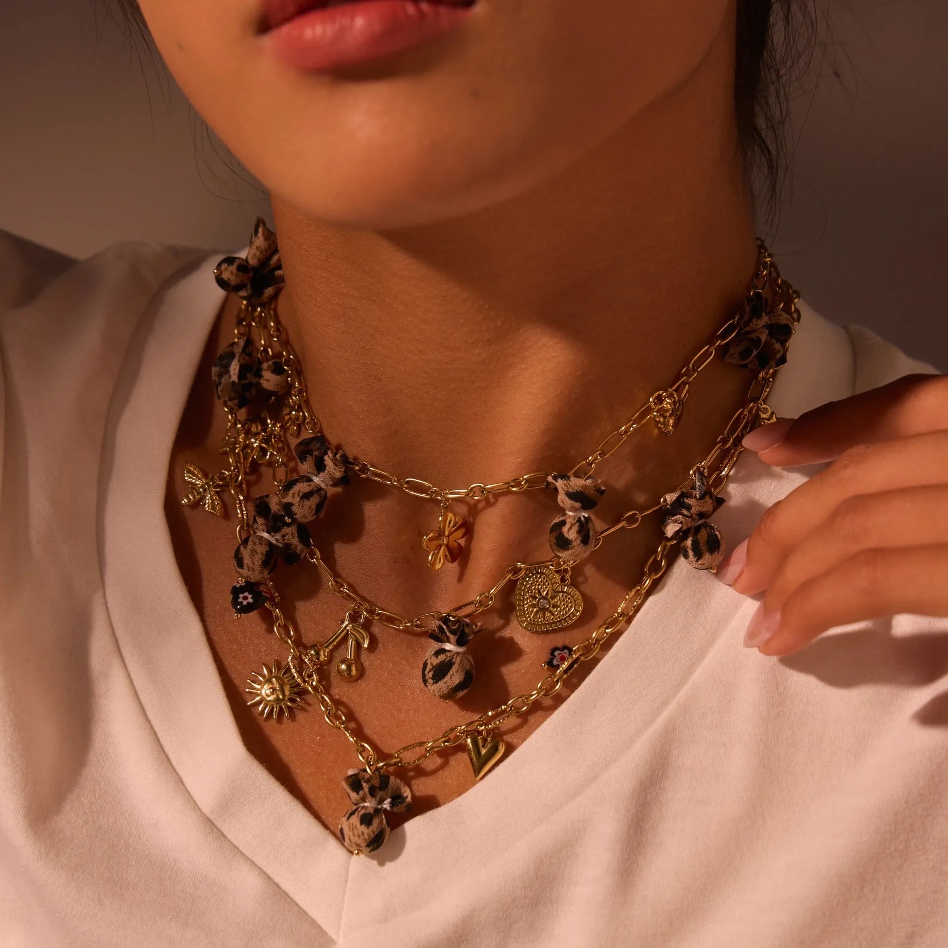 Leopard and love heart flowers pendant necklace on a stainless steel chain with gold electroplating.