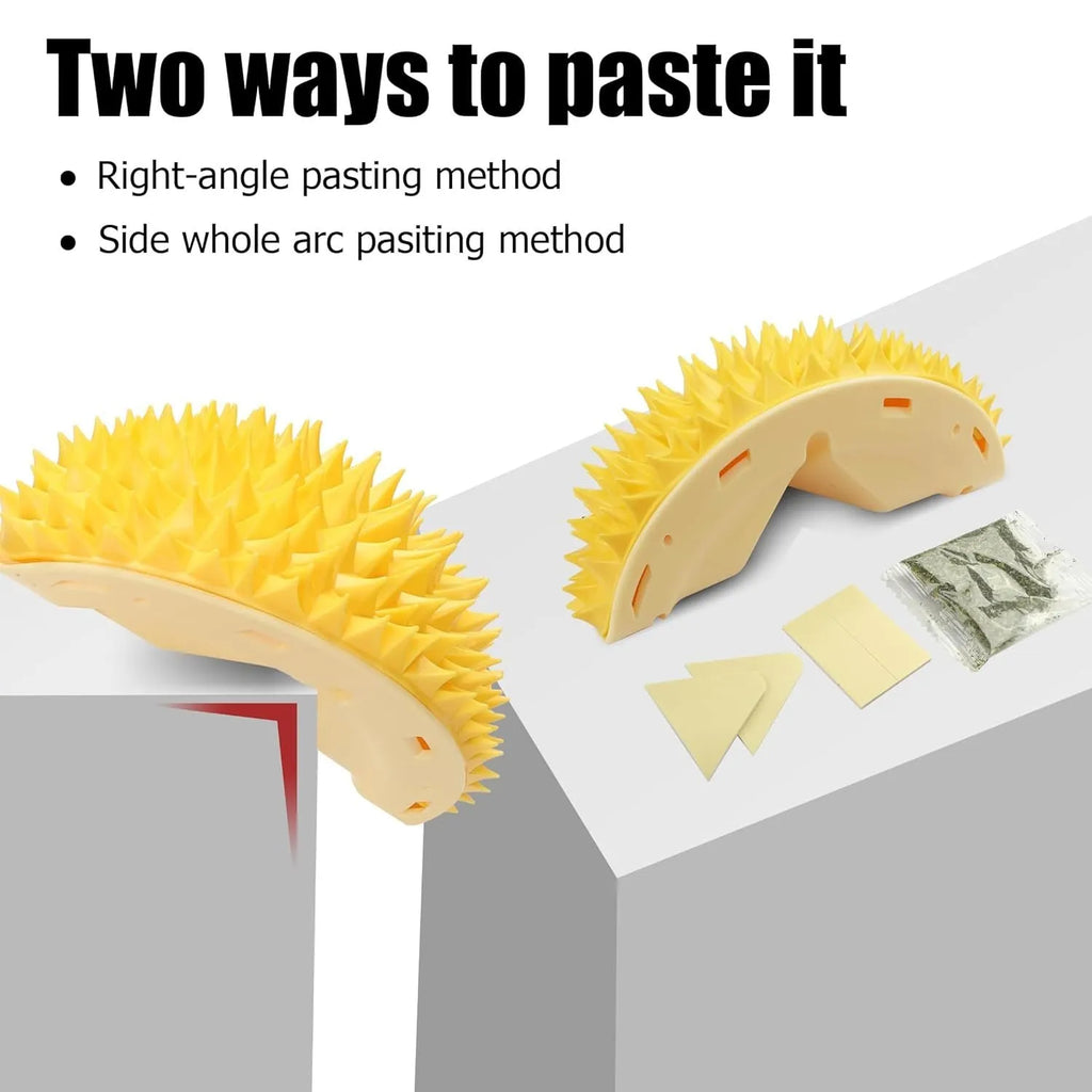 Yellow durian-shaped cat corner scratcher and grooming comb mounted on a wall corner.