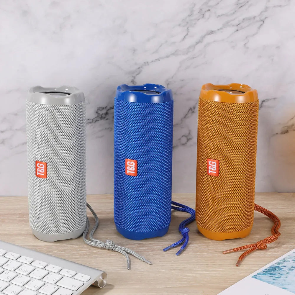 Fabric portable Bluetooth speaker with integrated card holder in one of six colour options.