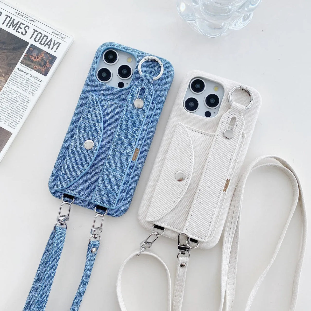 Denim blue leather phone case for iPhone 15 with wrist strap and built-in stand