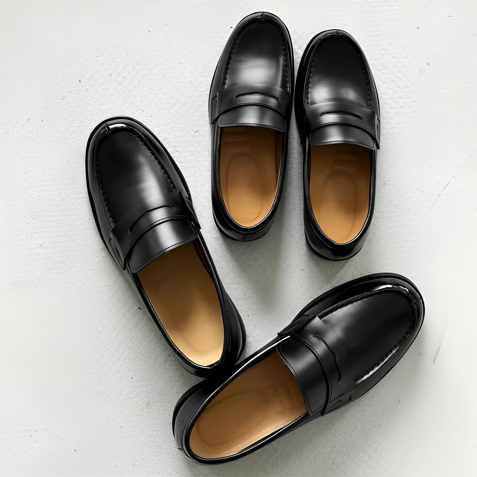 Black men's slip-on derby leather shoes with a rubber sole on a white background