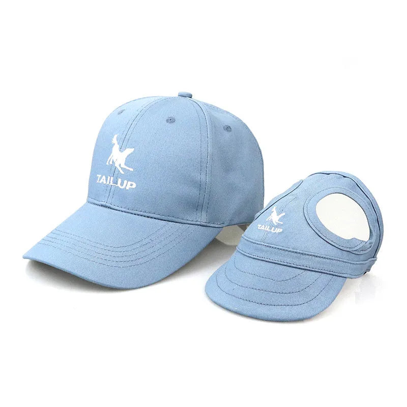 Canvas pet baseball cap for dogs and cats with adjustable buckle and Velcro, shown in black, blue, pink, and red