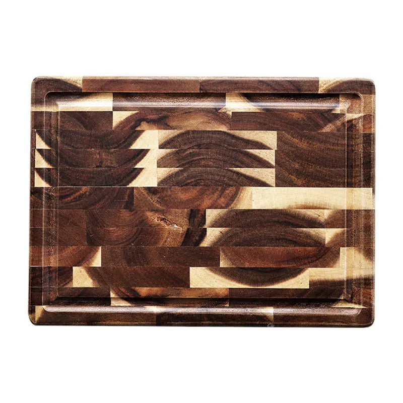 Brown solid wood chopping board with parquet pattern, shown on a kitchen countertop.