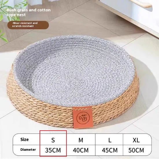 Woven rattan cat nest bed in a natural colour, shown in a nest shape.
