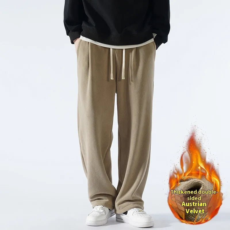 Man wearing apricot double-sided polar fleece lined loose fit casual sports trousers.