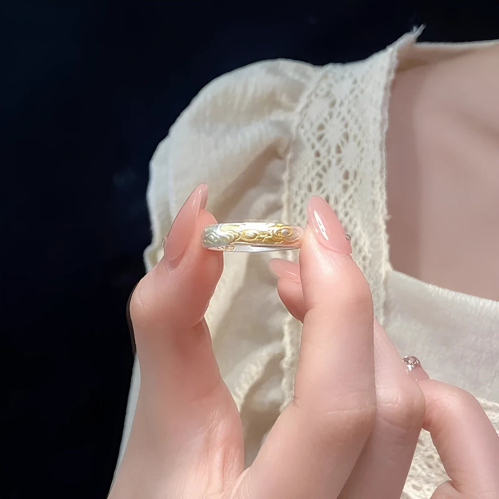 Open-mouth geometric white copper ring with Xiangyun pattern in silver-gold electroplate.