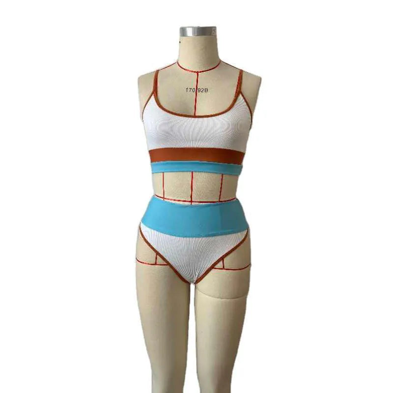Women's solid colour quick-drying nylon swimwear top and shorts set.