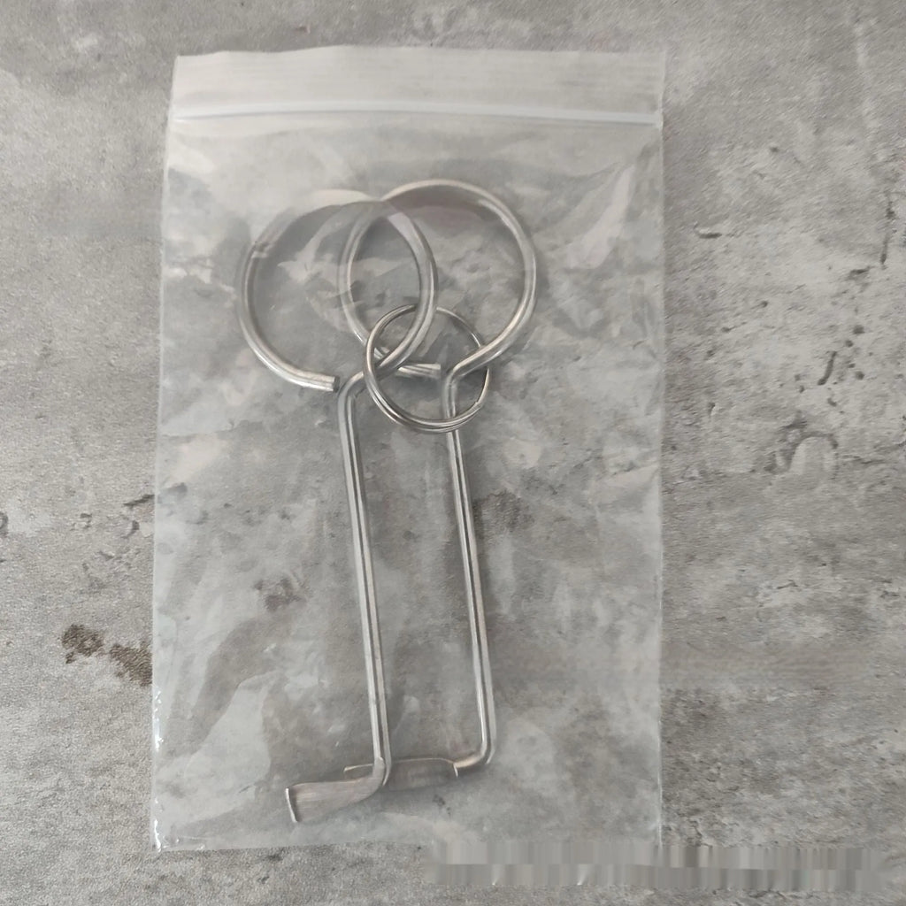 Two silver alloy universal wrench tools side by side on a surface.
