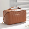 Vertical pattern cubic PU makeup bag in beige, shown with dimensions 22.5cm by 12.5cm.