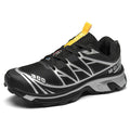 Low-top outdoor hiking shoes in artificial leather with mesh lining and rubber sole.