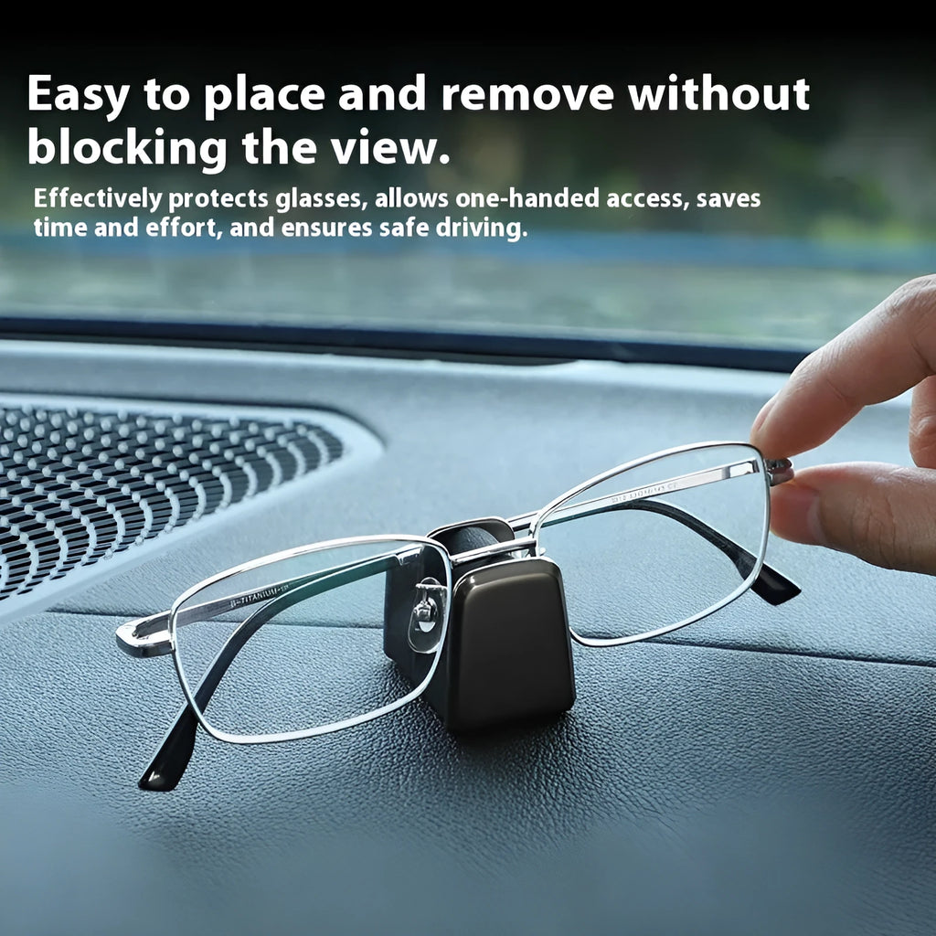 Zinc alloy and leather car dashboard clip for holding sunglasses, shown in green colour.