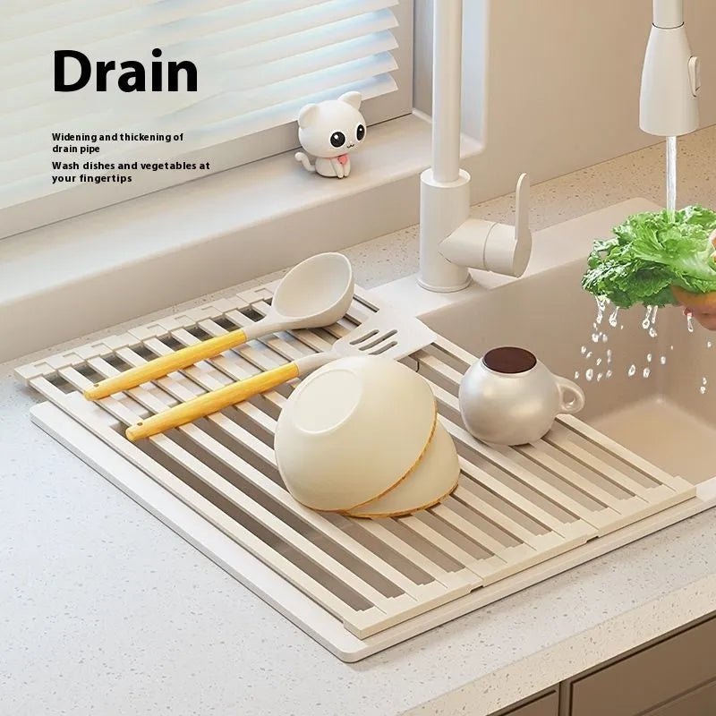 Foldable milky white stainless steel kitchen draining rack shown open and folded, next to a sink.