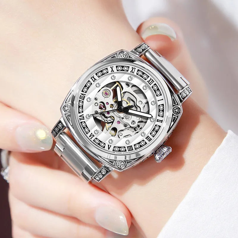 Mechanical watch with luminous hands and a black leather strap, showing 10m water resistance.