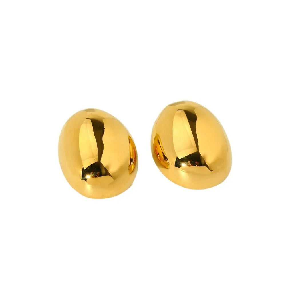 A pair of geometric stainless steel ear studs with an 18K gold plated, glazed surface and line detailing.