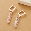 Rectangular two-tone hollow stud earrings with geometric design and electroplated finish