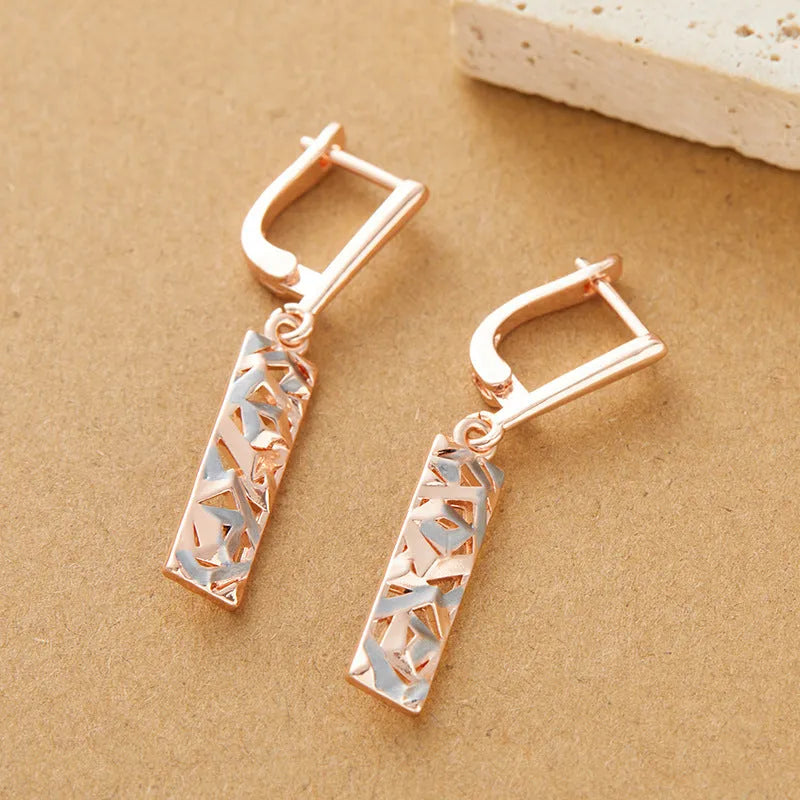 Rectangular two-tone hollow stud earrings with geometric design and electroplated finish
