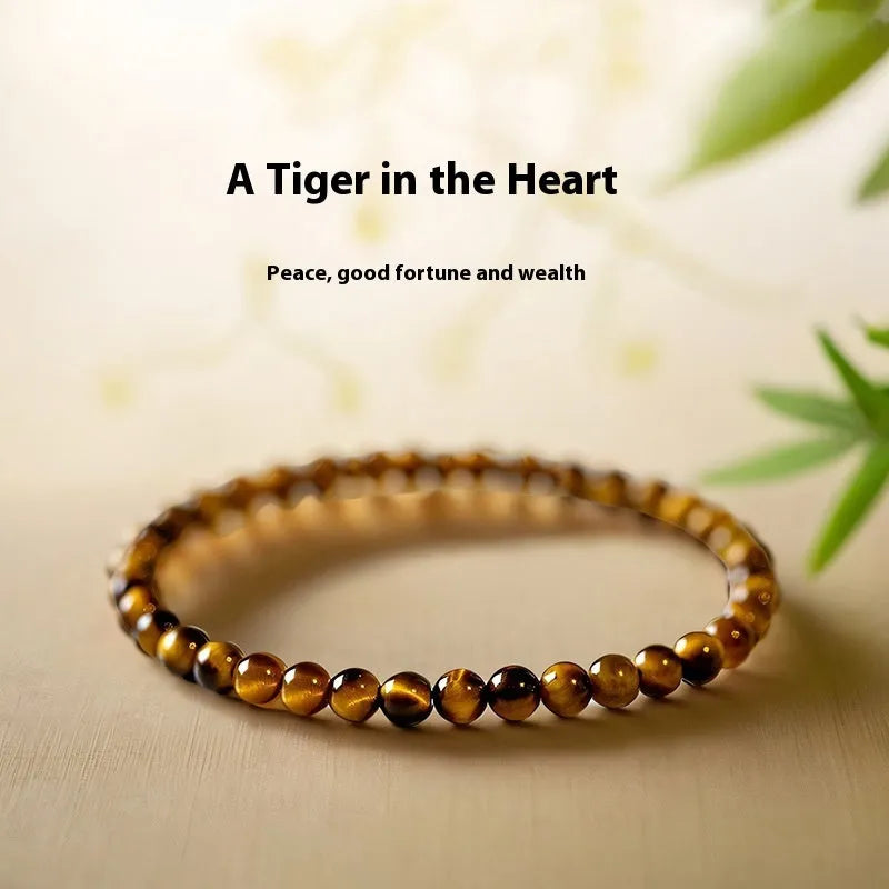 Tigereye stone bracelet with Chinese style geometric pattern in three bead sizes