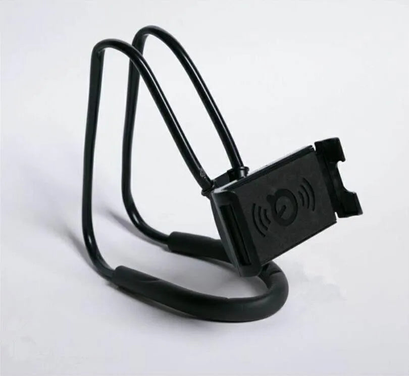 White plastic and foam 360-degree rotatable universal phone holder on a table.