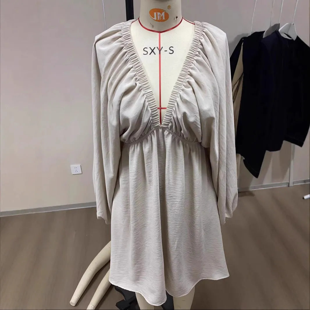 Women's apricot V-neck dress with puff sleeves and swing skirt design for office wear